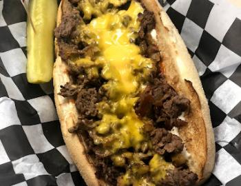 philly cheesesteak with a pickle spear at new york corner deli on topsail island, nc