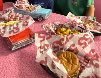 baskets of fries and burgers served at hwy 55, a 50s style diner