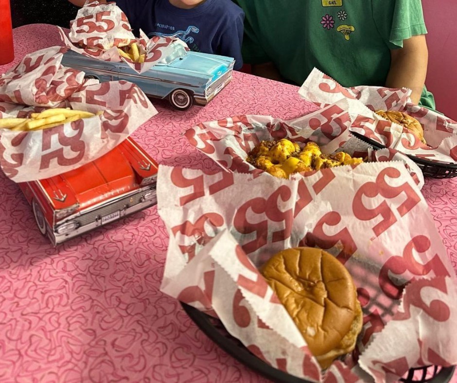 baskets of fries and burgers served at hwy 55, a 50s style diner